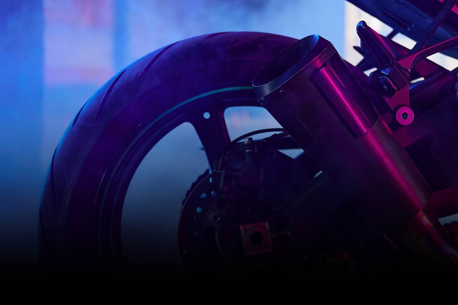 sport-motorcycle-wheel-view-from-back-in-neon-light-CROP