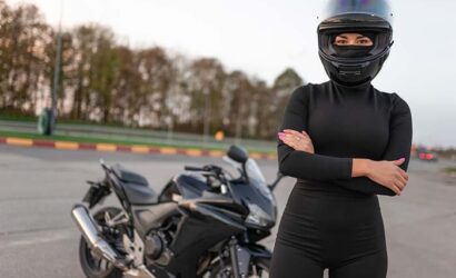 female-motorcyclist-in-helmet-and-black-clothes